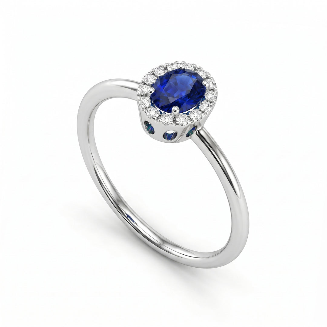 Mikiko an 18k oval sapphire 5x4 with diamond outline and smooth shank MA5234O4ZFN