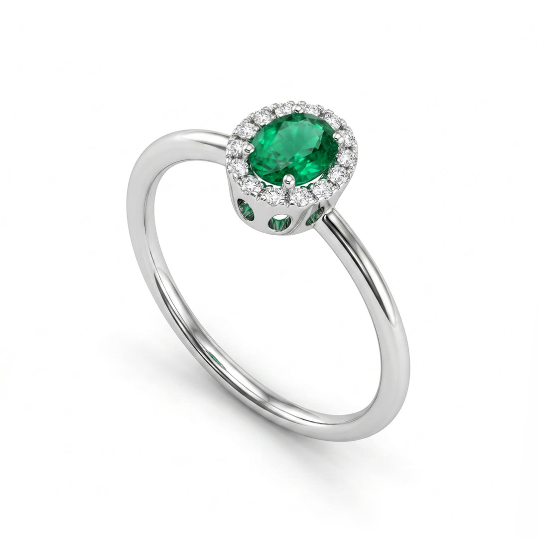 Mikiko an 18k oval emerald 5x4 with diamond outline and smooth shank MA5234O4SMN