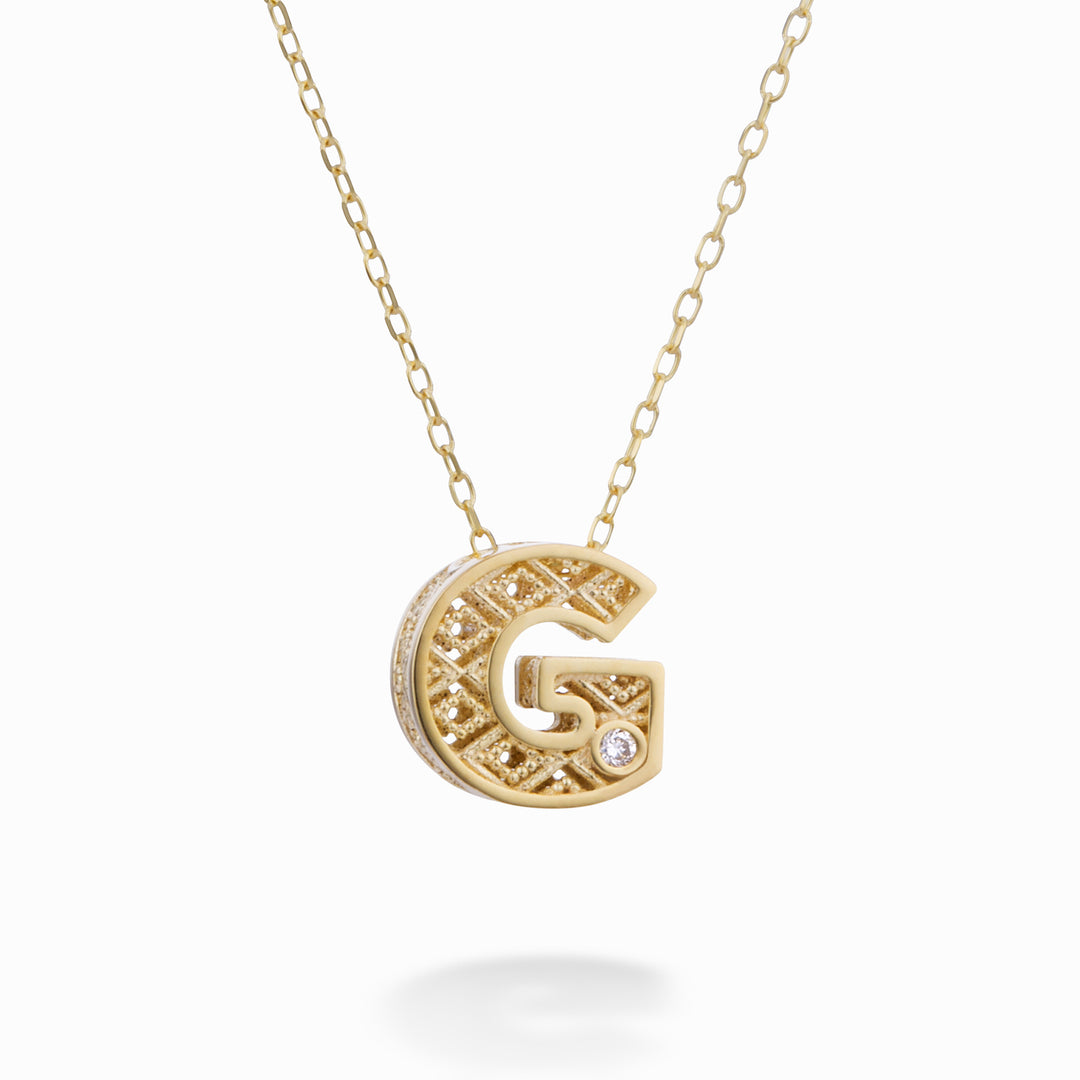 Nihama cl 18k letter g yellow gold diam. ct.0,01 NDLETGO1