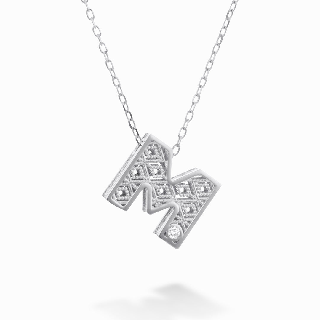 Nihama cl 18k letter m white gold diam. ct.0,01 NDLETMO4