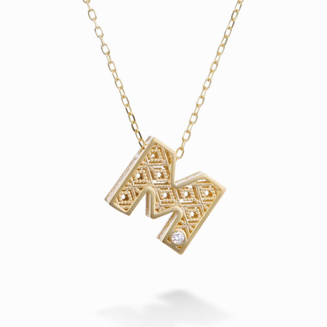 Nihama cl 18k letter m yellow gold diam. ct.0,01 NDLETMO1