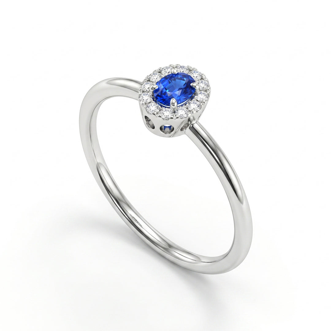 Nihama an 18k oval sapphire 4x3 with diamond outline and smooth shank NA5233O4ZFN