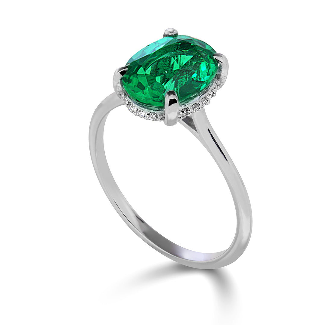 Mikiko an 18k oval emerald 10x8 set with diamonds MA5222O4BE