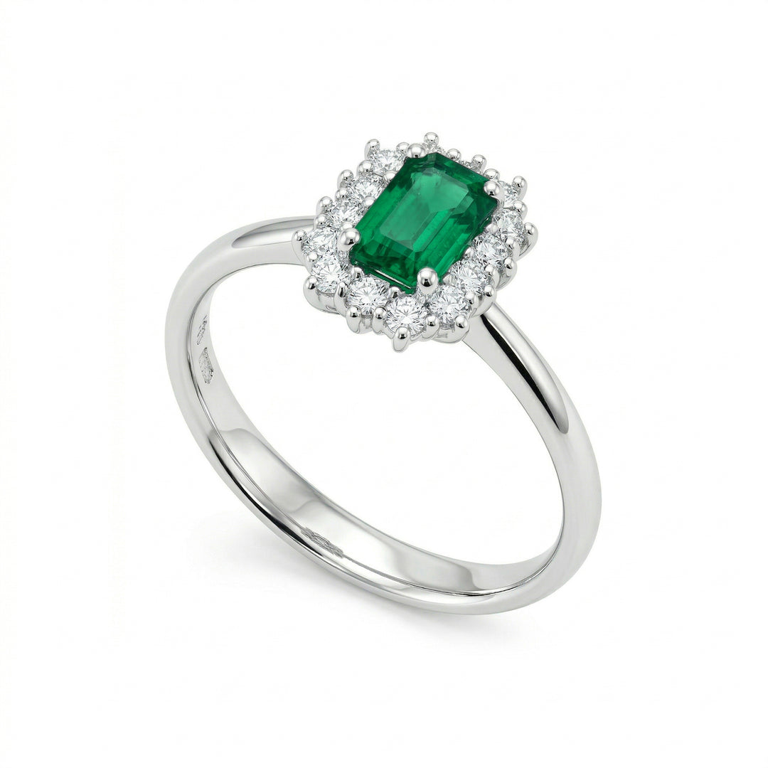 X-Diamond an 18kt octagonal emerald 7x5 and lab.g.d. 1.28 ct in total, center 0.86 ct and outline 0.42 ct XXDACL057O4BE75